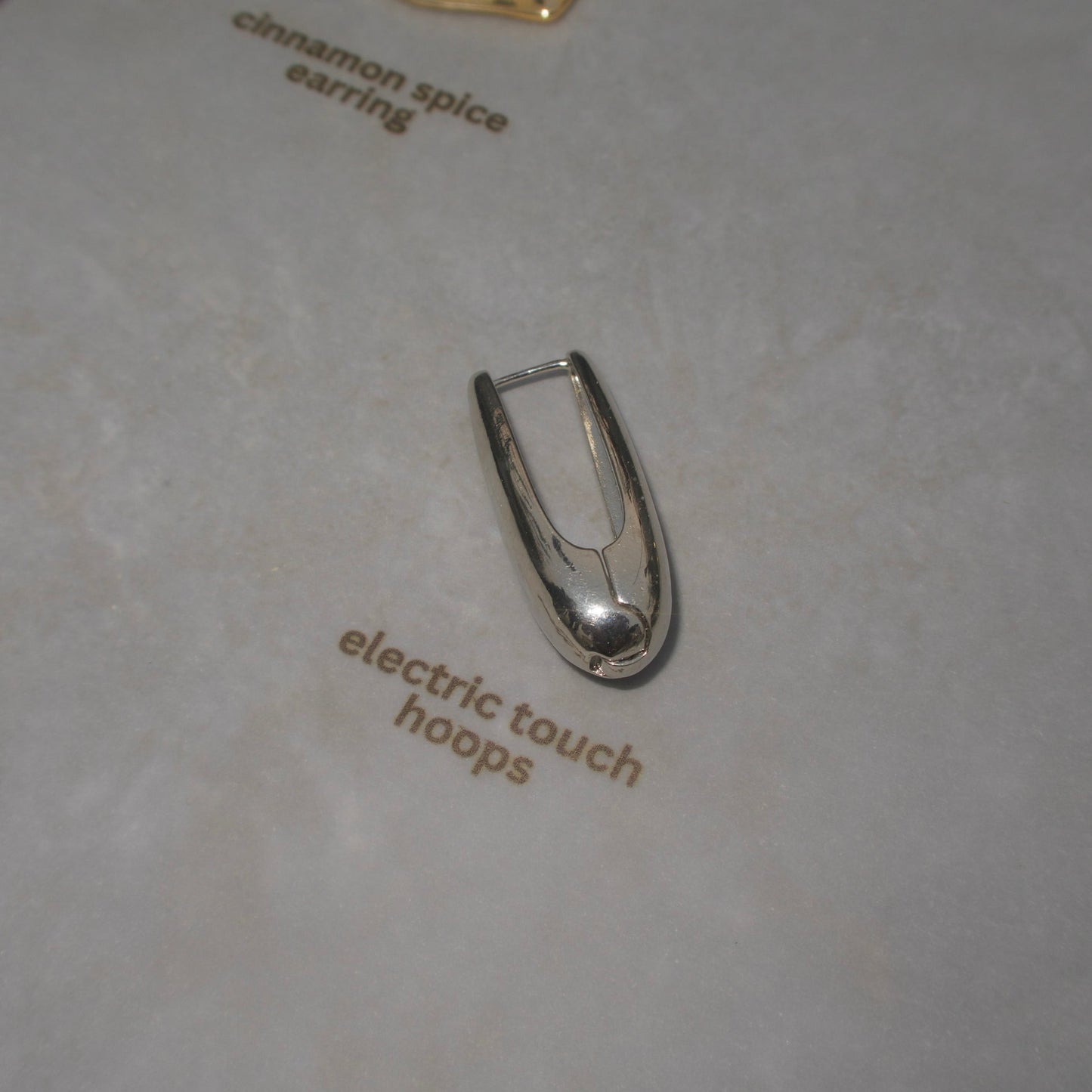 Electric touch silver hoops