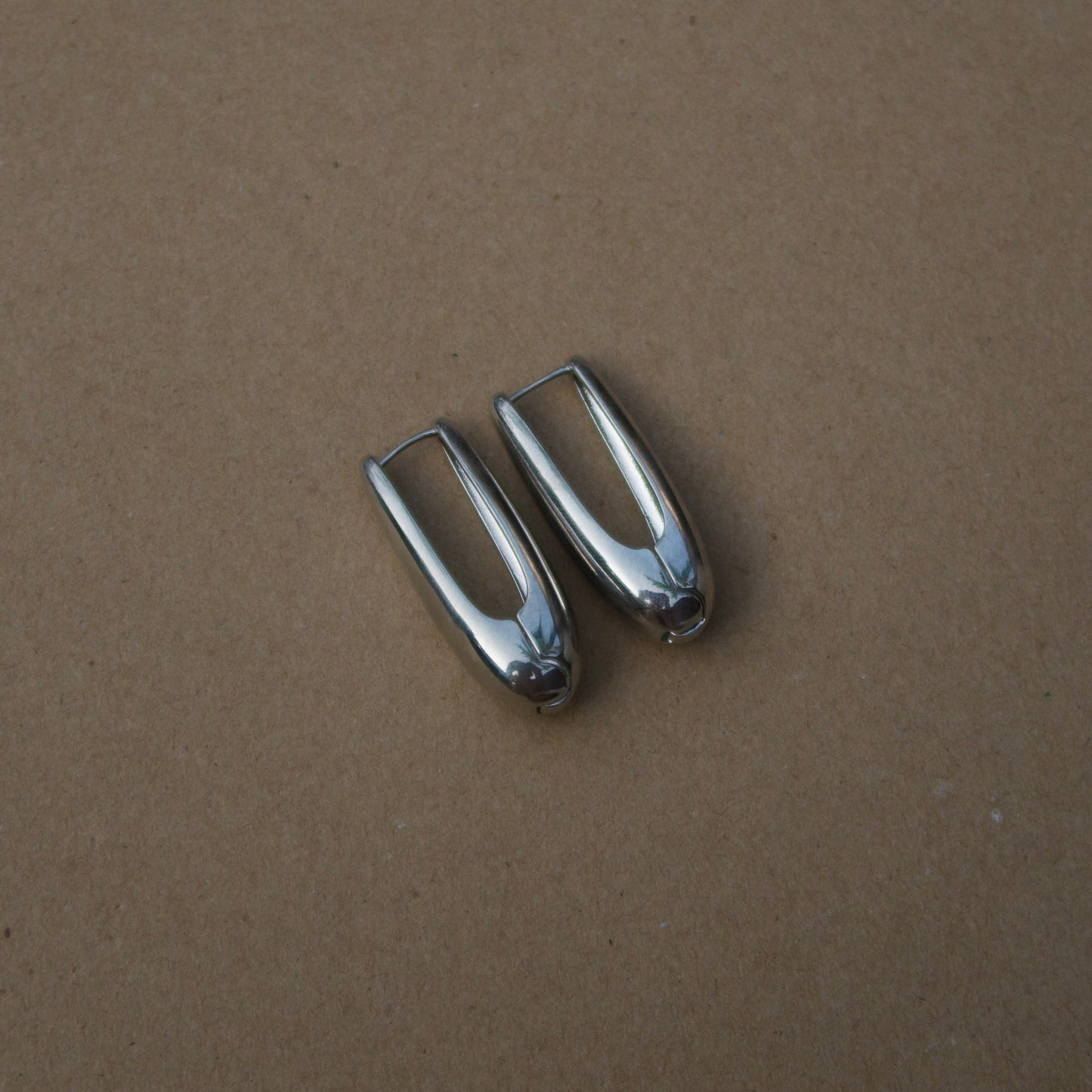 Electric touch silver hoops